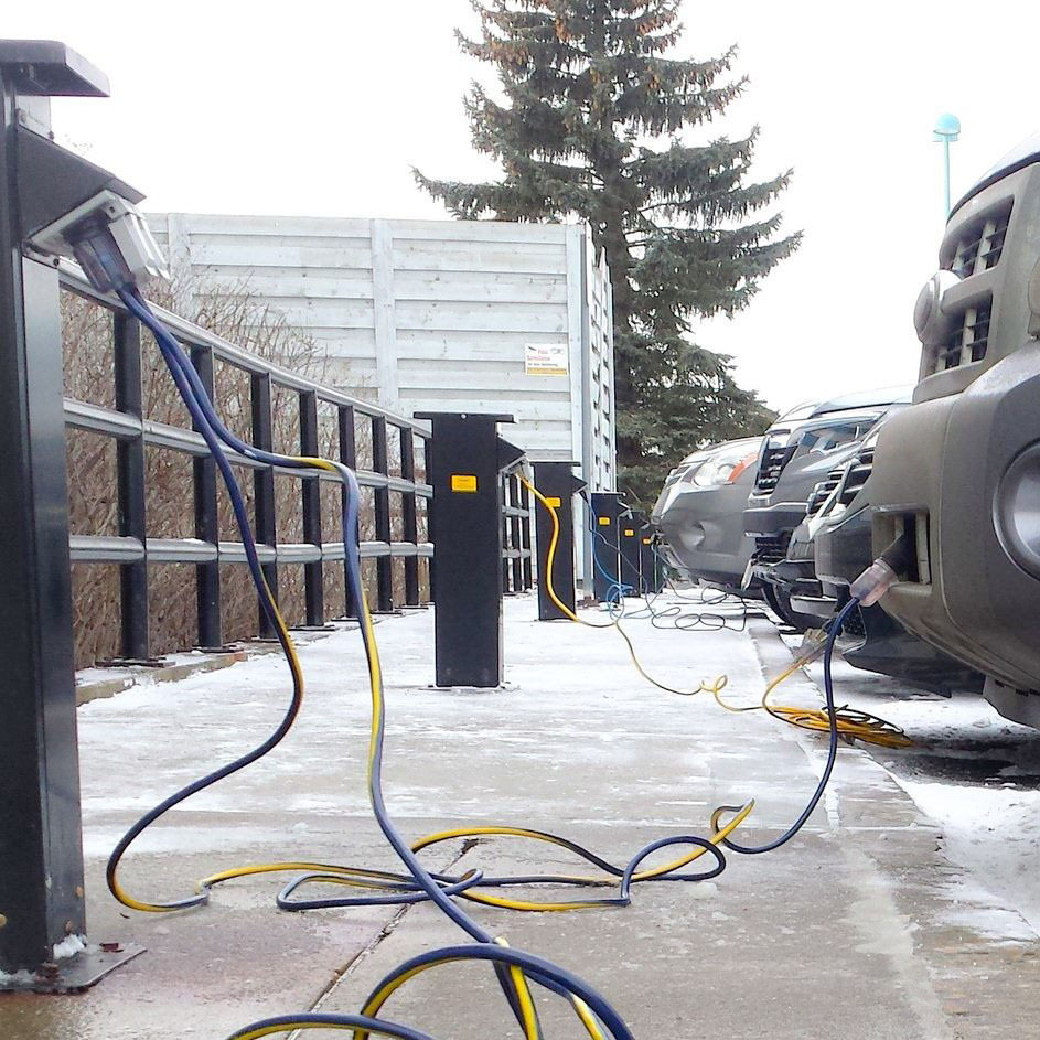 Row of cars plugged in during winter